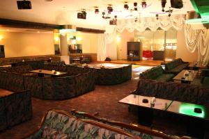 a large room with couches and tables in a restaurant at Hotel Towadaso in Towada