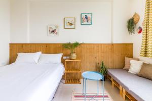 Voodi või voodid majutusasutuse Cozy Green Guesthouse toas