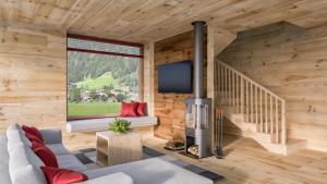 TV a/nebo společenská místnost v ubytování HOCHoben Chalets & Mobilhomes