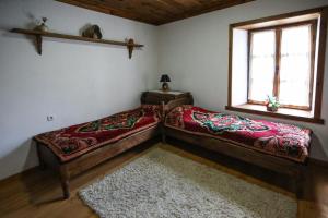 A bed or beds in a room at Тодорината къща