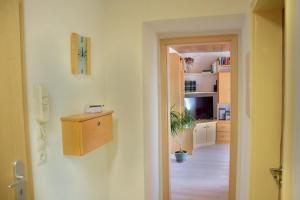 a room with a hallway and a room with a room at Ferienwohnung Close in Lindenberg im Allgäu