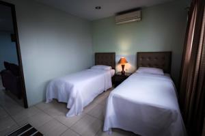 Letto o letti in una camera di Hotel Alma