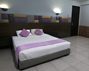 Letto o letti in una camera di Hotel Alma