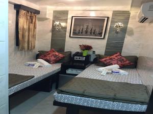 Voodi või voodid majutusasutuse Rich Hostel toas