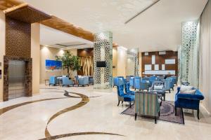 Гостиная зона в Hotel Santika Gresik