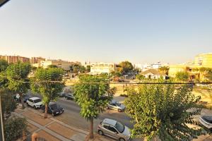 a city with cars parked in a parking lot at Apto Terrazas 3 Rooms 2 baños Cabildo Playa Parking in Sanlúcar de Barrameda +37 photos