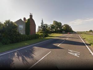 an empty road in front of a house at BlackbullA1lodge in Grantham