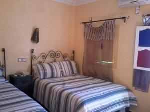 Postel nebo postele na pokoji v ubytování Hotel Rochers Peints