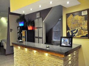 a bar in a restaurant with a tile counter at BARCELONA GOTIC Guesthouse in Barcelona