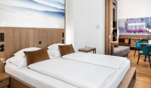 
A bed or beds in a room at Boutique Hotel am Stephansplatz
