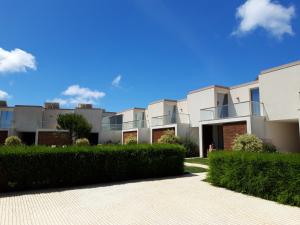 a row of apartment buildings on a sunny day at Sea Sagres in Sagres