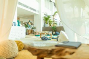 a living room with a couch and a table at Hayama Umino Hotel in Hayama