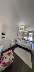 a large bedroom with two beds and a rug at La Mer Residence Beach Apartment in Golden Sands