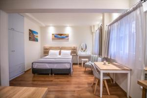 A bed or beds in a room at Levkosh Apartments at Lefkada's Heart