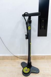 a black electric scooter tied to a wall at Spring Arona Gran Hotel - Adults Only in Los Cristianos