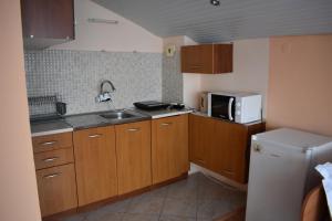 A kitchen or kitchenette at Exotic Guest House