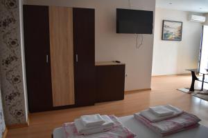 A television and/or entertainment centre at Exotic Guest House