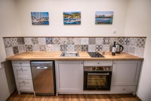 A kitchen or kitchenette at Levkosh Apartments at Lefkada's Heart