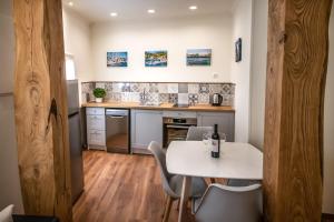 A kitchen or kitchenette at Levkosh Apartments at Lefkada's Heart