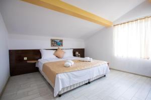 Krevet ili kreveti u jedinici u objektu Guest House Holiday