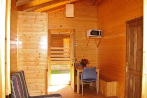 A television and/or entertainment centre at Camping Abadesses