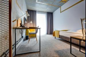 Postel nebo postele na pokoji v ubytování Hotel Arche Geologiczna