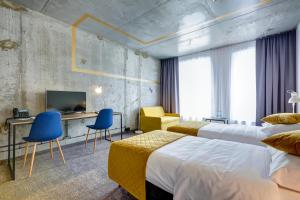 Postel nebo postele na pokoji v ubytování Hotel Arche Geologiczna