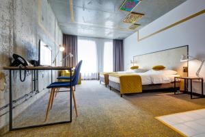 Postel nebo postele na pokoji v ubytování Hotel Arche Geologiczna