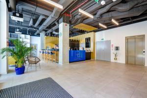 a large room with a table and chairs in it at Hotel Arche Geologiczna in Warsaw