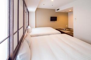 Postel nebo postele na pokoji v ubytování New Osaka Hotel + 31 fotografií