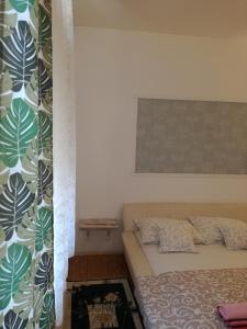 Postel nebo postele na pokoji v ubytování Apartman Centar