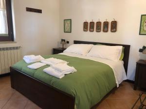 a bedroom with a bed with towels on it at Rifugio del Cavaliere in Ateleta +65 photos