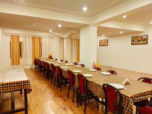 a large conference room with a long table and chairs at Shaolin Ladakh in Leh