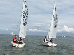 three people in small sailboats in the water at Pokoje Gościnne - U Wiktorii in Krynica Morska