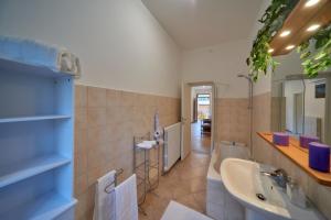 a bathroom with a sink and a bath tub at Casa della nonna in Abbadia Lariana