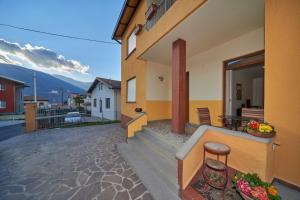 a balcony of a building with a table and chairs at Casa della nonna in Abbadia Lariana