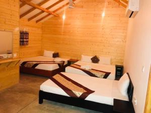 Postel nebo postele na pokoji v ubytování Trinco Relax Hut
