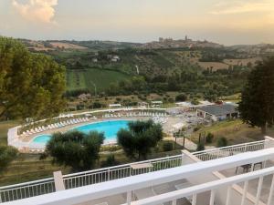 a view of the pool from the balcony of a resort at Casablanca Hotel in Civitanova Marche