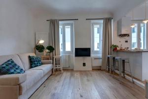 Televízia a/alebo spoločenská miestnosť v ubytovaní Scala Apartment by Mamo Florence