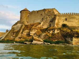 a castle on a hill next to the water at AKKERMAN-APPARTEMENT in Bilhorod-Dnistrovsʼkyy