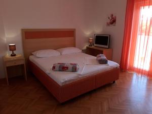 Postel nebo postele na pokoji v ubytování Apartments Renata