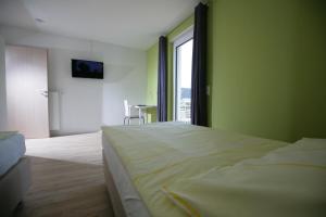 Ένα ή περισσότερα κρεβάτια σε δωμάτιο στο Apartments am Baronenwald
