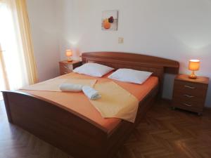 Postel nebo postele na pokoji v ubytování Apartments Renata