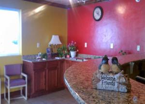 two stuffed animals sitting on a counter in a kitchen at Economy Inn & Suites in St. George