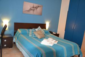 Letto o letti in una camera di B&B Due Fontane