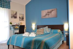 Letto o letti in una camera di B&B Due Fontane