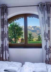 a window with a view of a mountain view at Willa Turnia in Kościelisko
