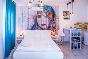 Postel nebo postele na pokoji v ubytování Jázmin Apartman