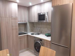 Kuchyň nebo kuchyňský kout v ubytování Apartamentos Vacacionales Joctis, 1º A