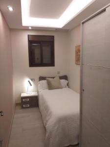 Postel nebo postele na pokoji v ubytování Apartamentos Vacacionales Joctis, 1º A